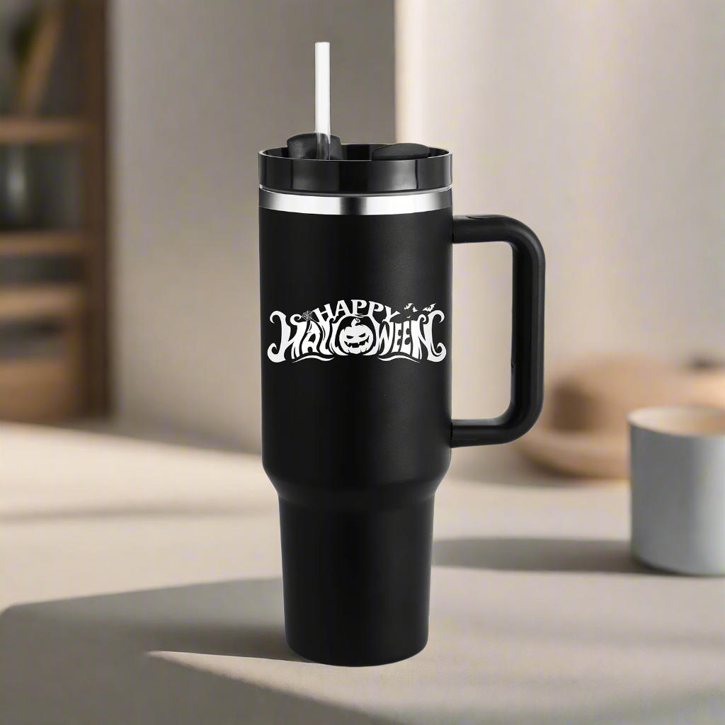 Black travel mug with 'Happy Halloween' text on a blurred background